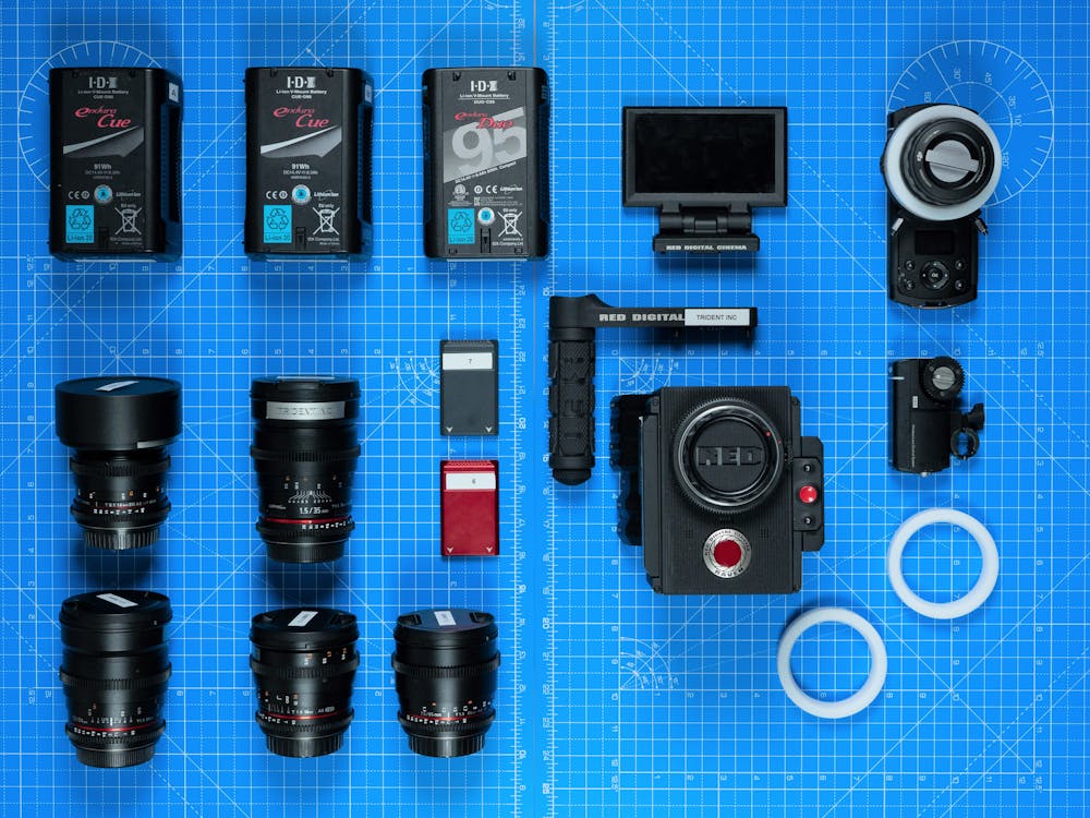 Professional camera equipment with lenses and batteries