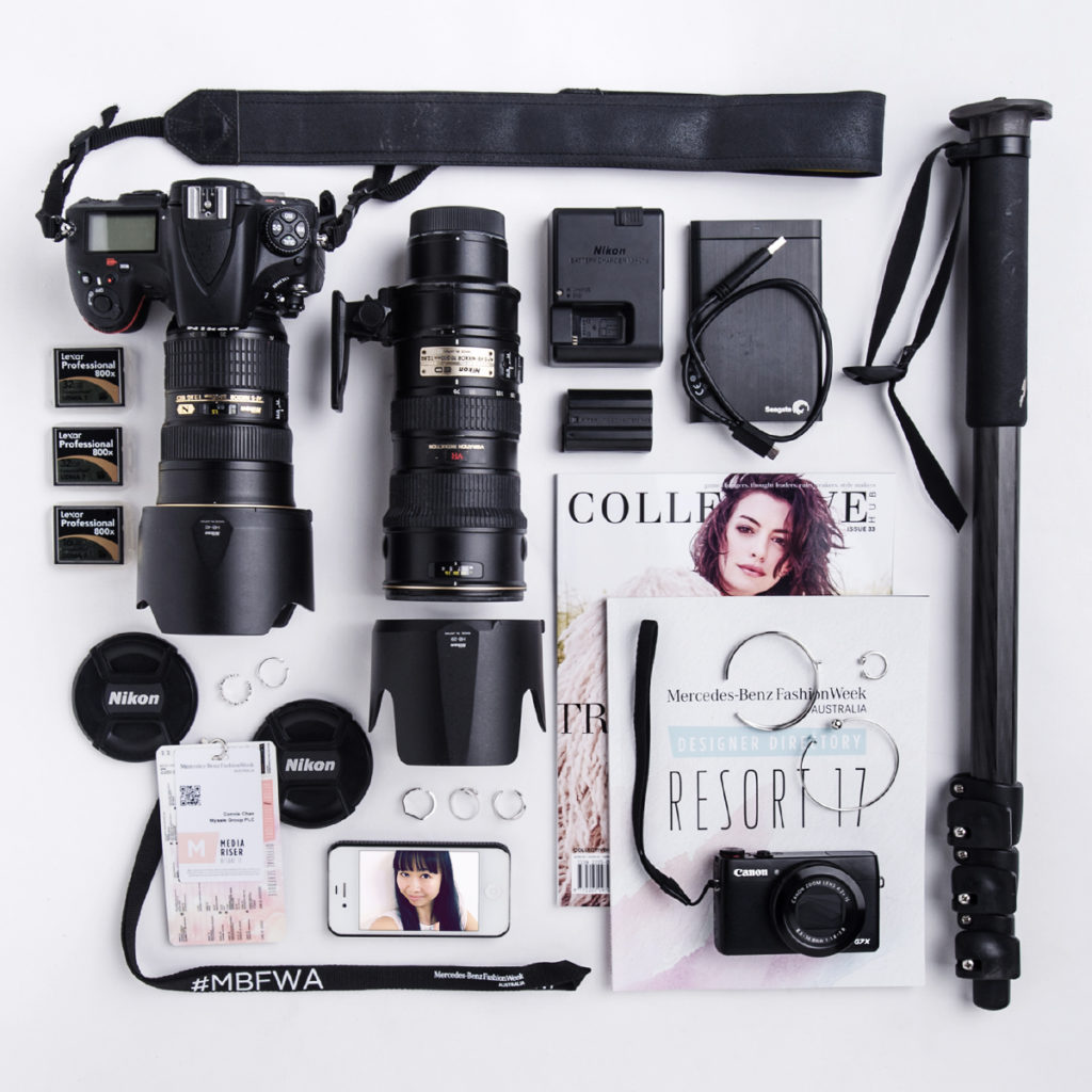 Professional photography gear arranged on white background